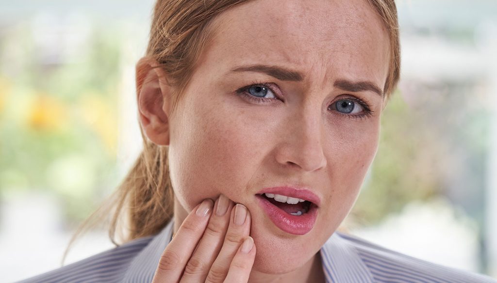 woman with oral pain