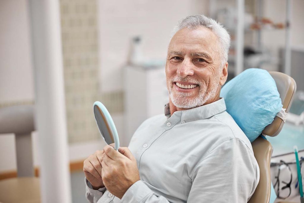happy man at dental office